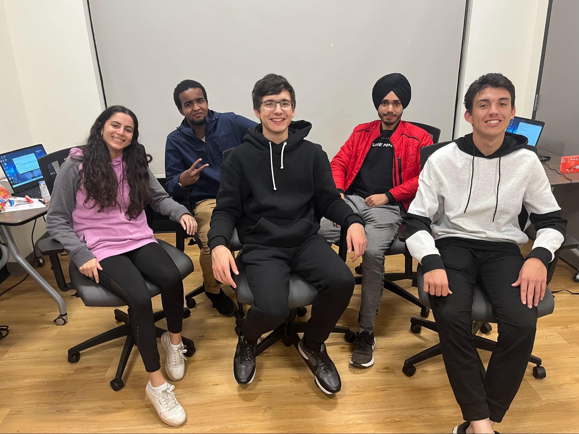 Hack the Red Island at STEAM PEI in Charlottetown, Prince Edward Island. From left: Priya Jain (coach), Adnan Hussein, German Ivkovich, Persehaj Singh Baidwan, and Mohamad Eyad Allaham.